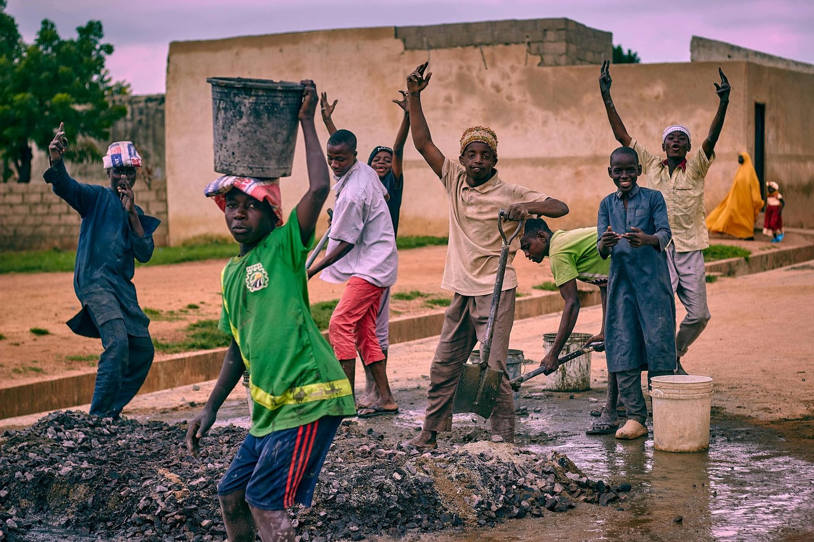 joyful group of young workers on construction site